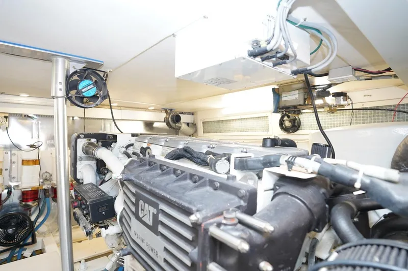 Etan Yacht Photos Pics Engine room of 2005 Ocean Yachts 50 Super Sport, featuring CAT marine power engine.