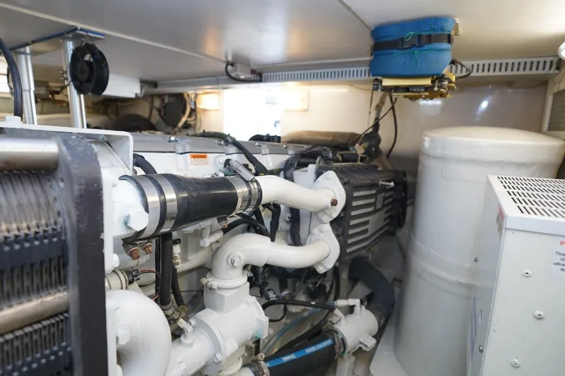 Etan Yacht Photos Pics Engine room of 2005 Ocean Yachts 50 Super Sport, showcasing mechanical components and systems.