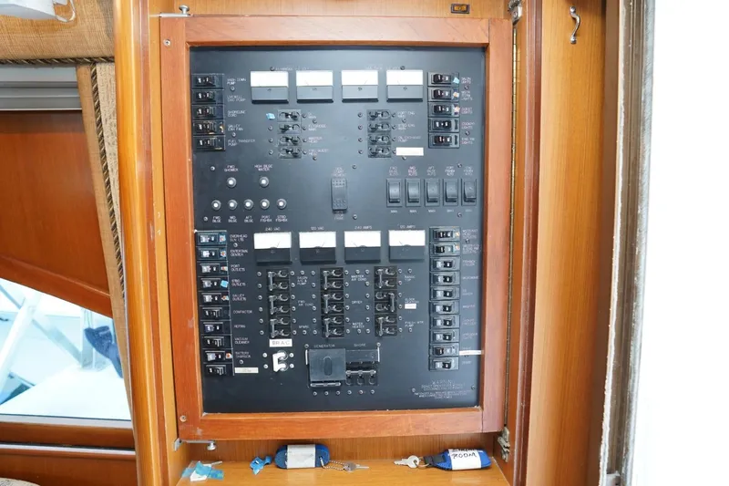 Etan Yacht Photos Pics Electrical panel of 2005 Ocean Yachts 50 Super Sport boat, featuring switches and circuit breakers.