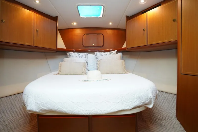 Etan Yacht Photos Pics Luxurious cabin interior of 2005 Ocean Yachts 50 Super Sport with cozy bedding.