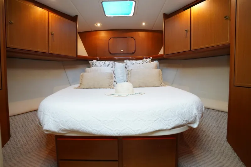 Etan Yacht Photos Pics Luxurious cabin interior of 2005 Ocean Yachts 50 Super Sport with cozy bedding.