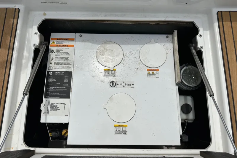  Yacht Photos Pics Engine compartment of a 2018 Jeanneau 54 sailboat, featuring a generator.