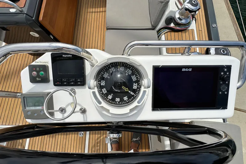  Yacht Photos Pics Cockpit of 2018 Jeanneau 54 yacht with navigation instruments and compass.