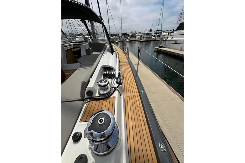  Yacht Photos Pics Jeanneau 54 sailboat deck, 2018 model, docked at marina with polished winches.