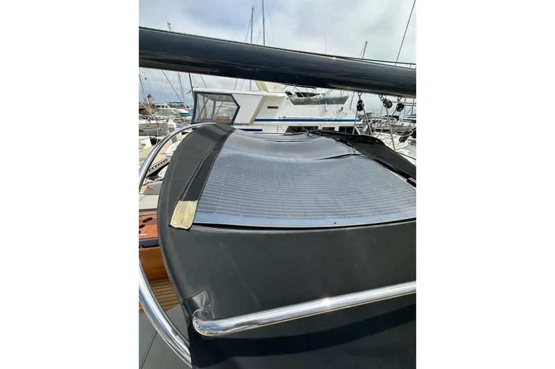  Yacht Photos Pics 2018 Jeanneau 54 yacht with solar panel on deck, docked at marina.
