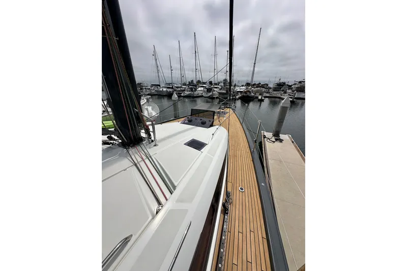  Yacht Photos Pics 2018 Jeanneau 54 yacht docked at marina, showcasing sleek deck design.