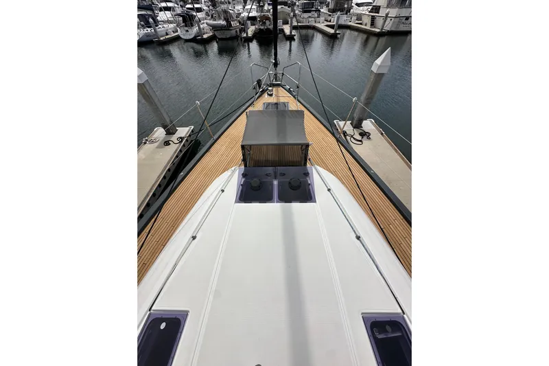  Yacht Photos Pics 2018 Jeanneau 54 yacht docked at marina, showcasing sleek deck design.