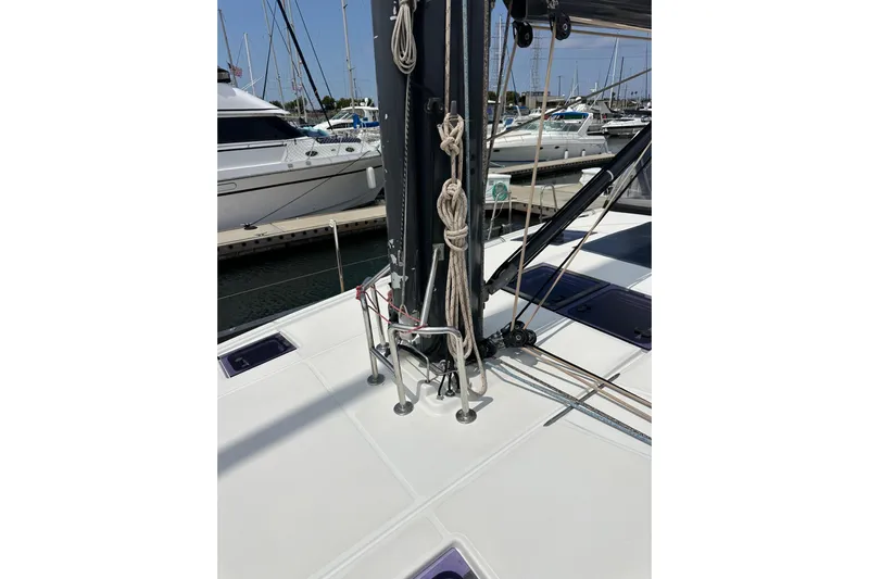  Yacht Photos Pics 2018 Jeanneau 54 sailboat deck with mast and rigging in marina.