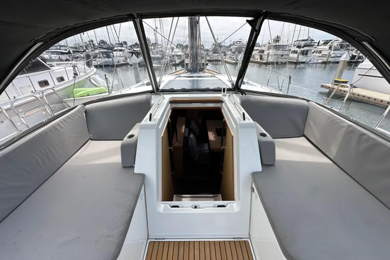  Yacht Photos Pics 2018 Jeanneau 54 yacht cockpit with spacious seating and marina view.