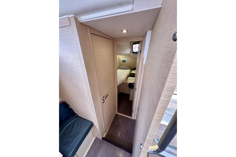  Yacht Photos Pics Interior cabin of 2018 Jeanneau 54 yacht with cozy bedroom and modern design.