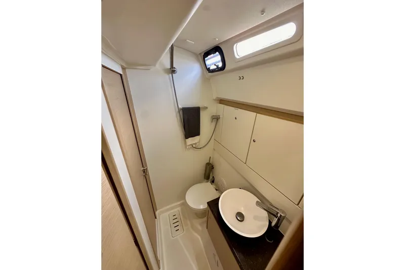  Yacht Photos Pics 2018 Jeanneau 54 yacht bathroom with modern fixtures and compact design.