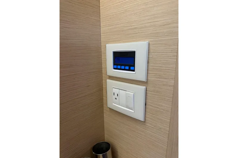  Yacht Photos Pics Control panel and outlet on Jeanneau 54 yacht, 2018 model, wooden interior.