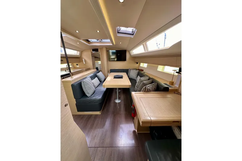  Yacht Photos Pics Luxurious interior of 2018 Jeanneau 54 yacht with modern seating and elegant design.