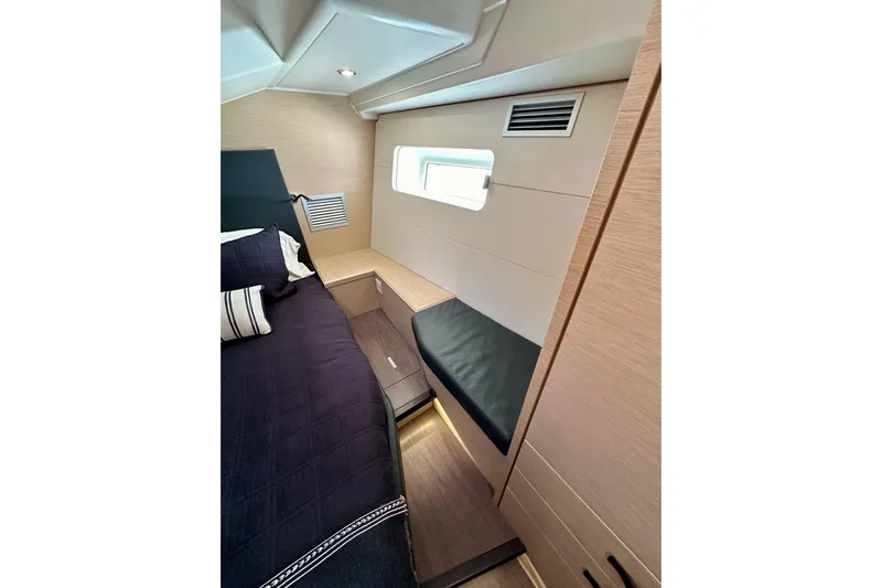  Yacht Photos Pics Luxurious interior cabin of 2018 Jeanneau 54 yacht with modern design and cozy bedding.