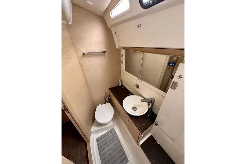  Yacht Photos Pics 2018 Jeanneau 54 yacht bathroom with modern fixtures and sleek design.