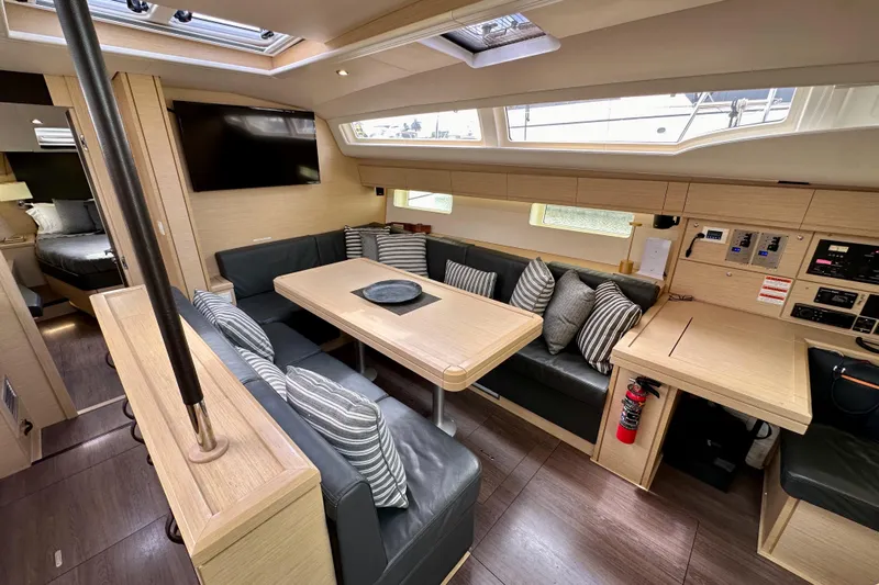  Yacht Photos Pics Luxurious interior of 2018 Jeanneau 54 yacht with modern seating and dining area.