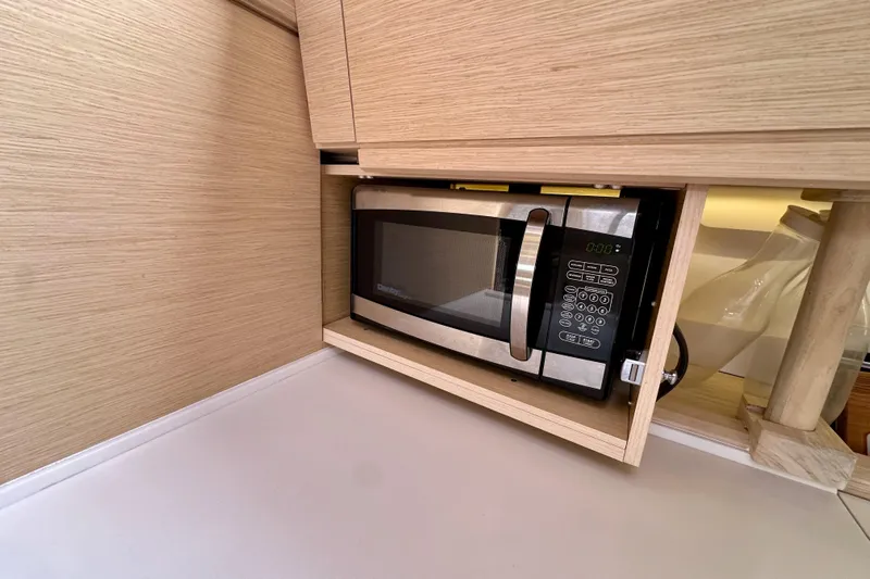  Yacht Photos Pics Built-in microwave in Jeanneau 54 yacht's modern kitchen, 2018 model.