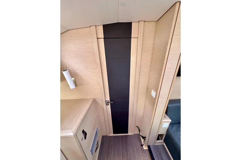  Yacht Photos Pics Interior of 2018 Jeanneau 54 yacht, featuring sleek wooden paneling and modern design elements.