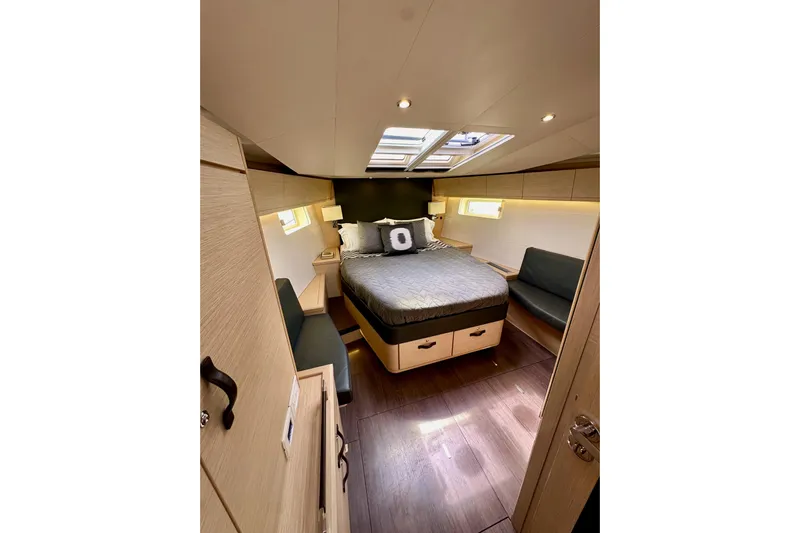  Yacht Photos Pics Luxurious interior cabin of 2018 Jeanneau 54 yacht with modern furnishings.