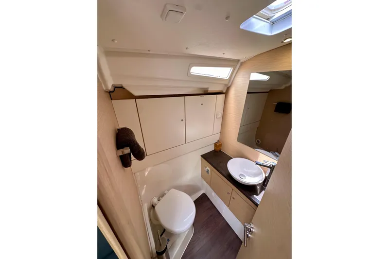  Yacht Photos Pics 2018 Jeanneau 54 yacht bathroom with modern fixtures and ample storage.