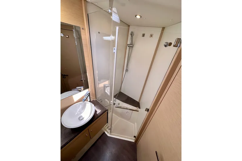  Yacht Photos Pics Modern bathroom in 2018 Jeanneau 54 yacht with shower and sink.