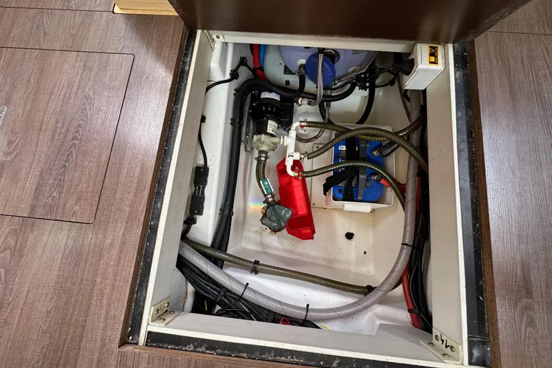  Yacht Photos Pics Engine compartment of a 2018 Jeanneau 54 yacht, showing mechanical components and wiring.