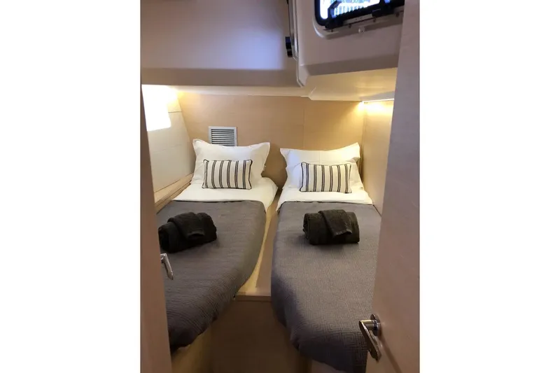  Yacht Photos Pics Luxurious cabin interior of 2018 Jeanneau 54 yacht with twin beds and elegant decor.
