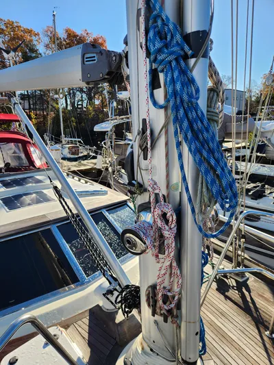 Lizette Yacht Photos Pics Sailboat deck with ropes and mast, Regina 43 model, year 2000, in a marina setting.