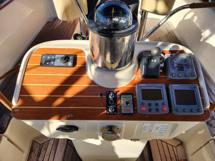 Lizette Yacht Photos Pics Cockpit of a 2000 Regina 43 yacht with navigation instruments and controls.