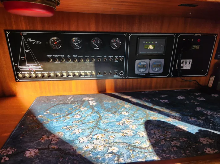 Lizette Yacht Photos Pics Control panel of a 2000 Regina 43 boat with floral-patterned surface.