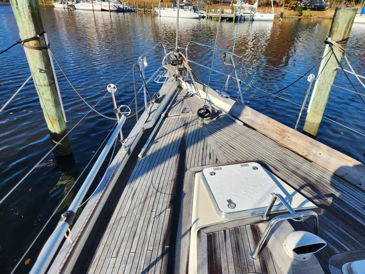 Lizette Yacht Photos Pics Sailboat deck view, Regina 43 model, 2000, docked at marina with calm water.