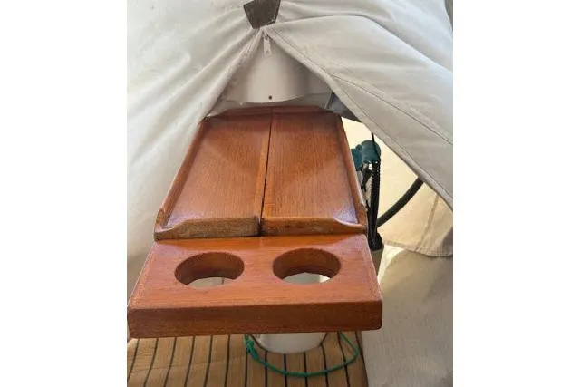 Pacifico Yacht Photos Pics Wooden table with cup holders on a 2005 Beneteau 393 sailboat.
