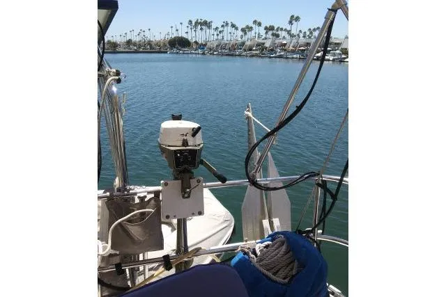 Pacifico Yacht Photos Pics 2005 Beneteau 393 sailboat stern view in marina with palm trees.