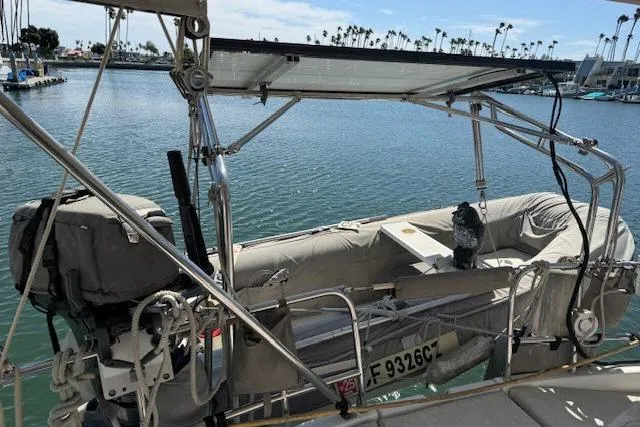 Pacifico Yacht Photos Pics Beneteau 393 sailboat with dinghy, docked in a marina, 2005 model.