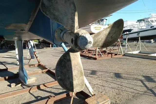 Pacifico Yacht Photos Pics Propeller of a 2005 Beneteau 393 sailboat on dry dock.