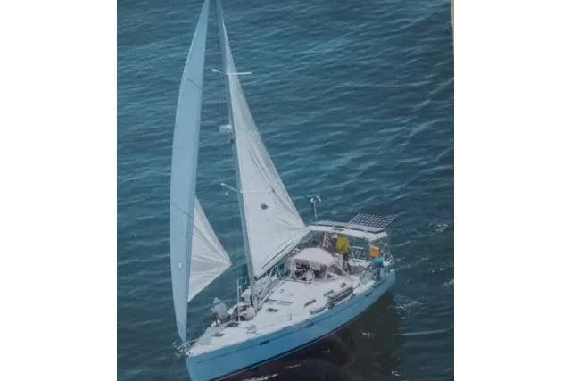 Pacifico Yacht Photos Pics Sailing yacht Beneteau 393, 2005 model, cruising on open water with full sails.