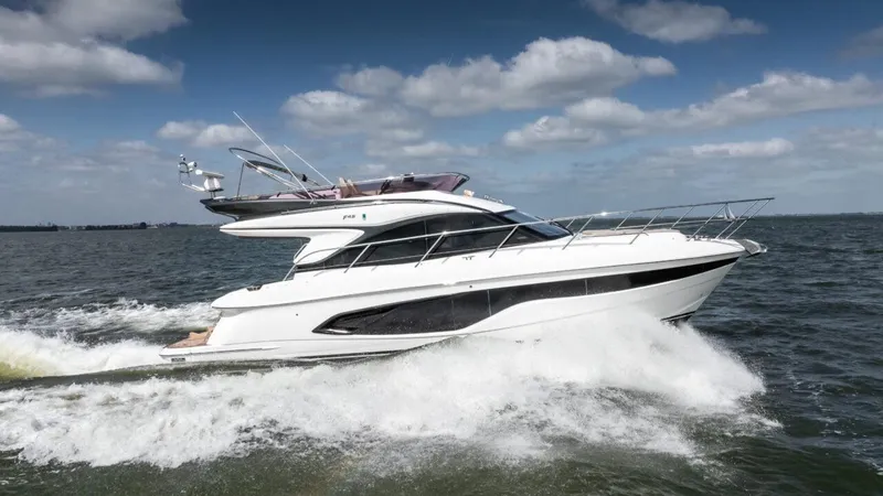  Yacht Photos Pics 2019 Princess F45 yacht cruising on open water under a clear blue sky.