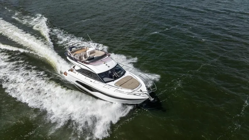  Yacht Photos Pics 2019 Princess F45 yacht cruising on open water, aerial view.