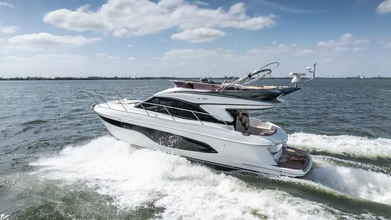 Yacht Photos Pics 2019 Princess F45 yacht cruising on open water under a clear sky.