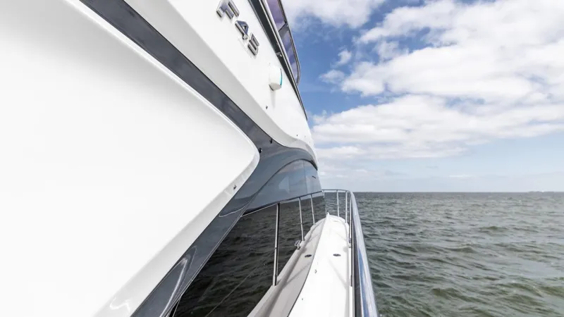  Yacht Photos Pics 2019 Princess F45 yacht cruising on open water under a partly cloudy sky.