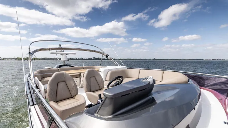  Yacht Photos Pics 2019 Princess F45 yacht with luxurious seating on open water under a blue sky.