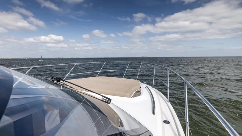  Yacht Photos Pics 2019 Princess F45 yacht cruising on open water under a partly cloudy sky.