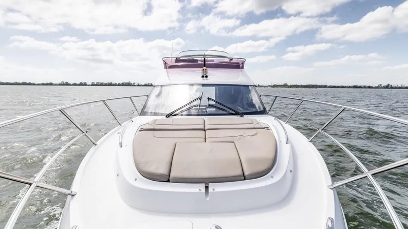  Yacht Photos Pics 2019 Princess F45 yacht cruising on open water under a partly cloudy sky.