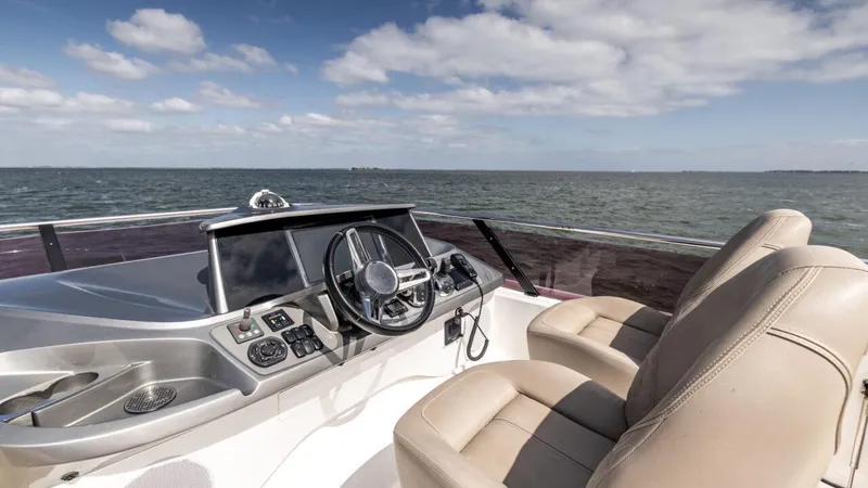  Yacht Photos Pics Helm of 2019 Princess F45 yacht with ocean view and clear sky.