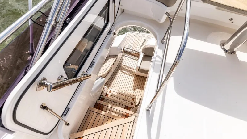  Yacht Photos Pics Staircase on 2019 Princess F45 yacht with sleek design and wooden finish.