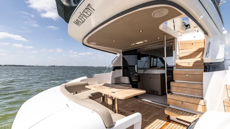  Yacht Photos Pics Luxurious 2019 Princess F45 yacht with elegant deck and seating, cruising on open water.