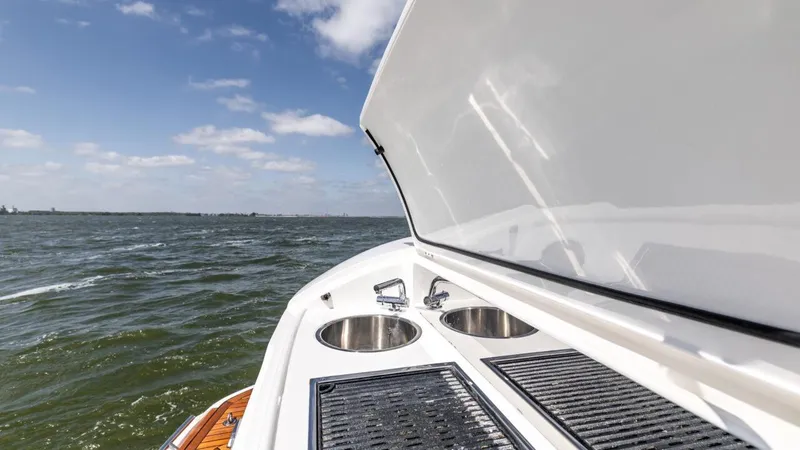  Yacht Photos Pics 2019 Princess F45 yacht with outdoor sink and grill on open water.