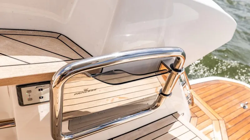  Yacht Photos Pics 2019 Princess F45 yacht deck with stainless steel railing and teak flooring.