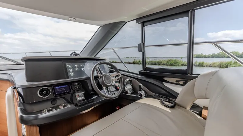  Yacht Photos Pics Interior of 2019 Princess F45 yacht, featuring modern helm and panoramic windows.