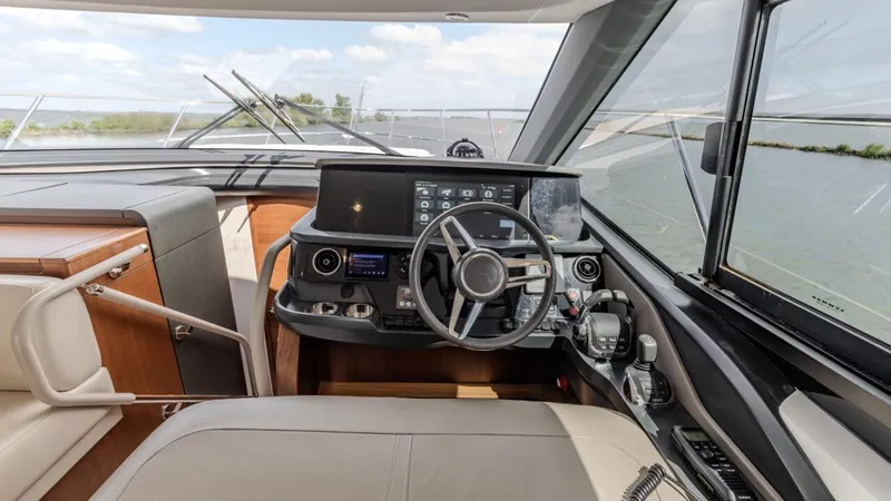  Yacht Photos Pics Interior view of 2019 Princess F45 yacht cockpit with modern navigation controls.
